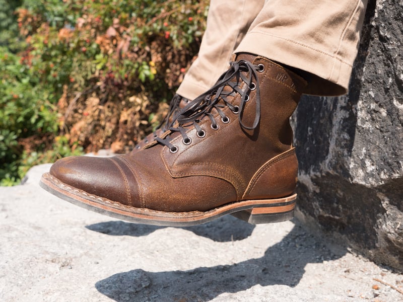 My toughest boots are White's Service Boot. Pictured here dangling. The hard wearing rugged leather looks great with work pants