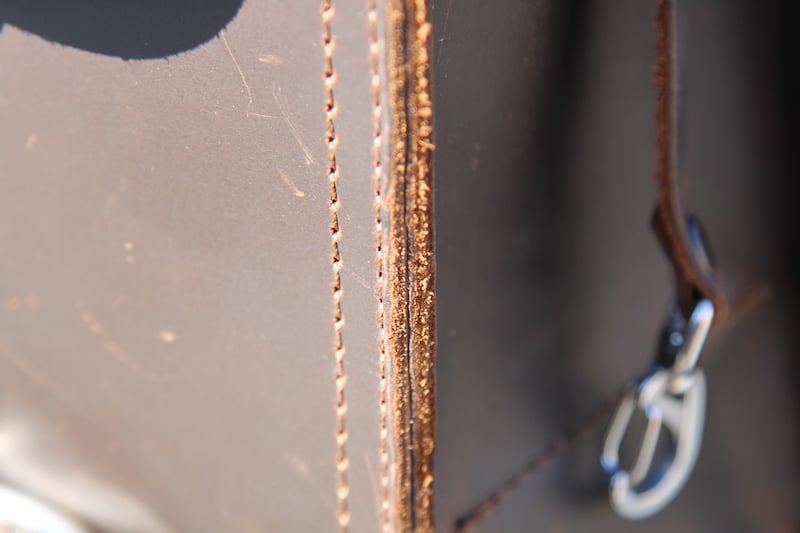 raw edges on saddleback bag