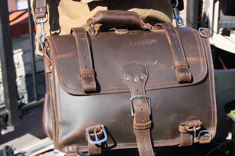 saddleback leather briefcase on person