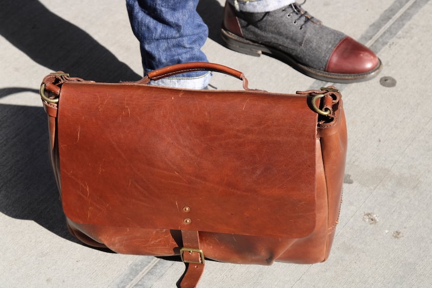 satchel and page mailbag at feet