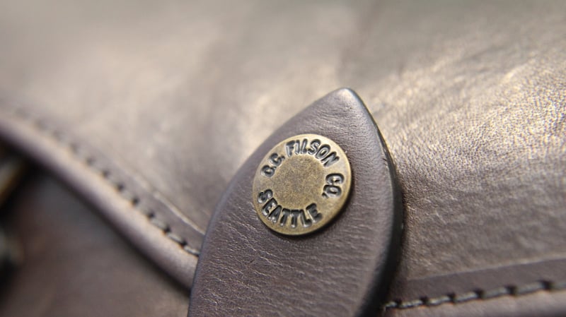 filson leather briefcase snap closure