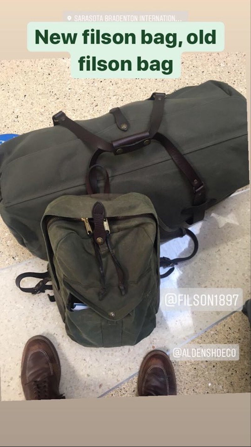 Filson Large Duffle next to the Filson Joueny