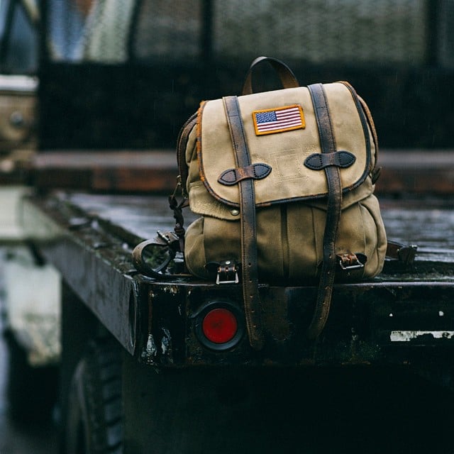 Filson's roll top bag. I've had it for around six years. The twill has  broken in nicely and has handled admirably even in downpours without so  much as getting anything wet inside. 