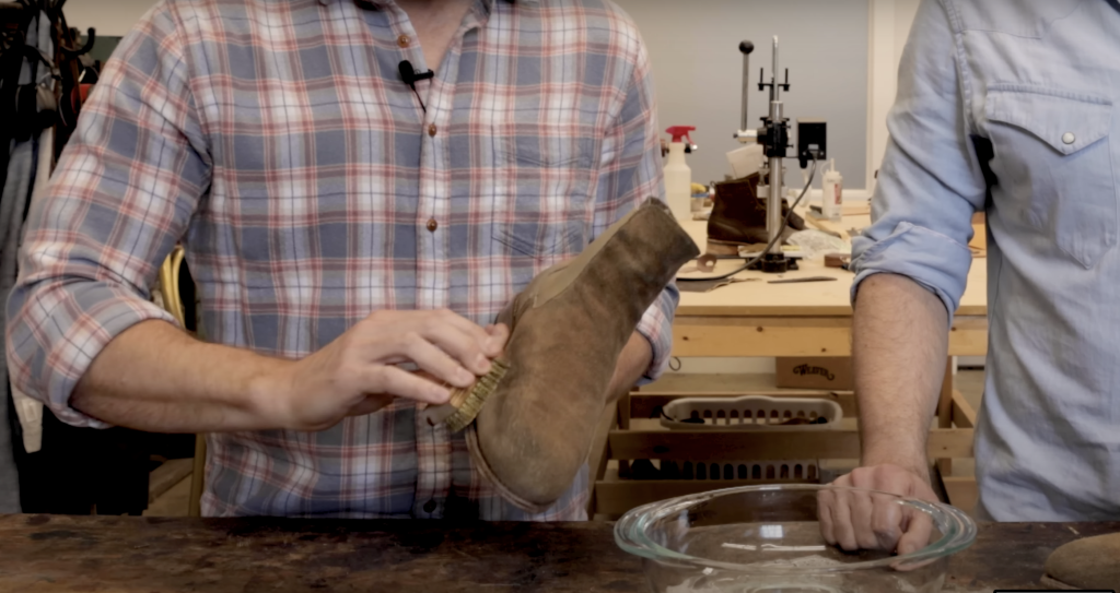 Brushing suede Chelsea boots 