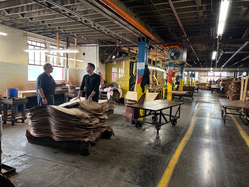 people talking at a horween leather factory chicago