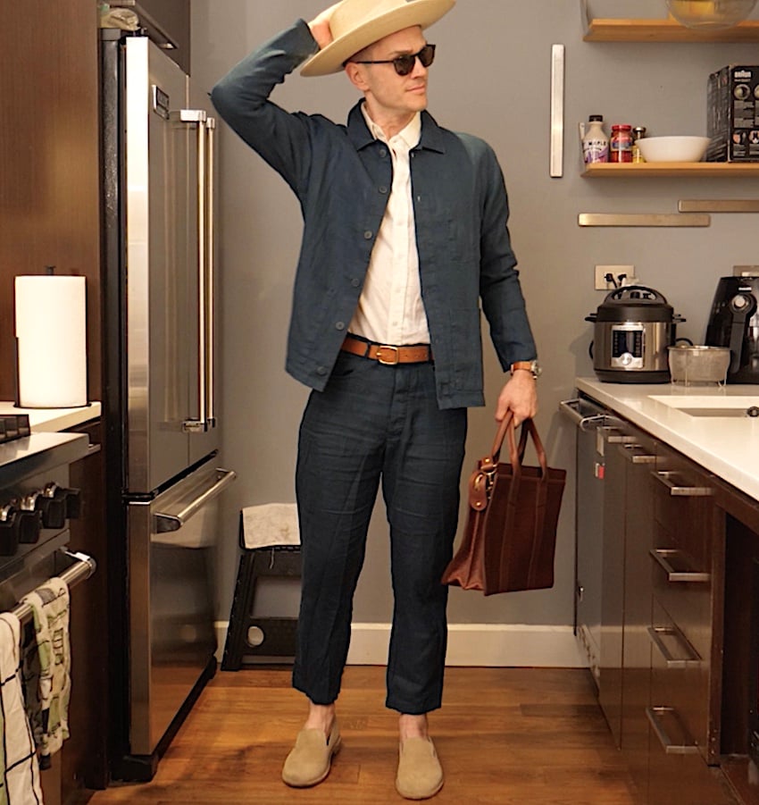 a man in an all linen travel outfit