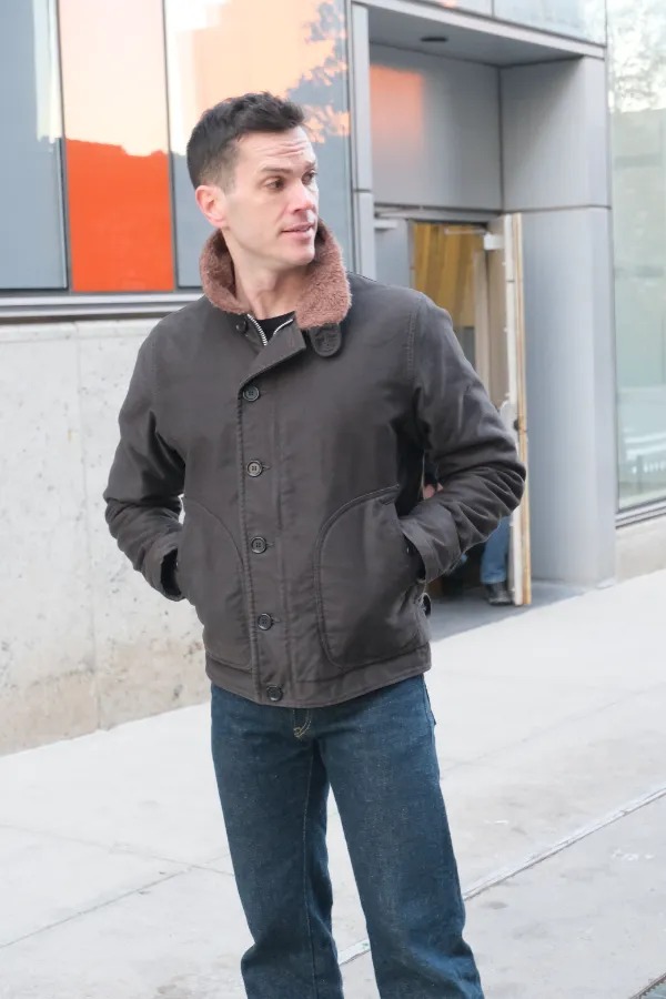 nick in the black deck jacket
