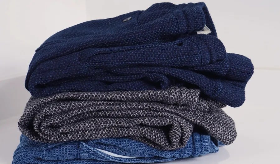 Three types of apres pants in a stack