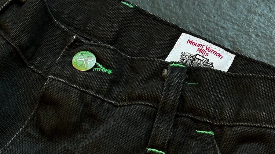 Left Field Mount Vernon Mills black canvas pants with green stitching details.