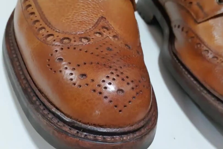 Close up of broguing most commonly found on British boots
